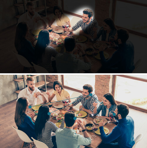 Mehrere Menschen essen an einem Tisch